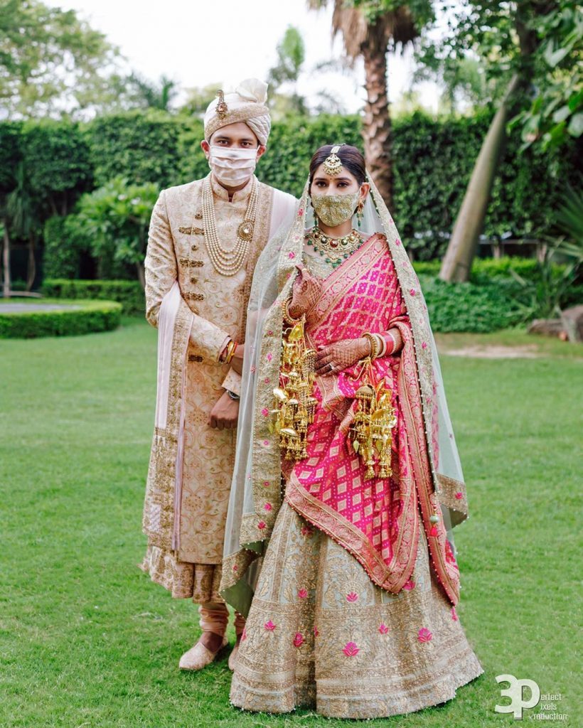 bride and groom indian outfits