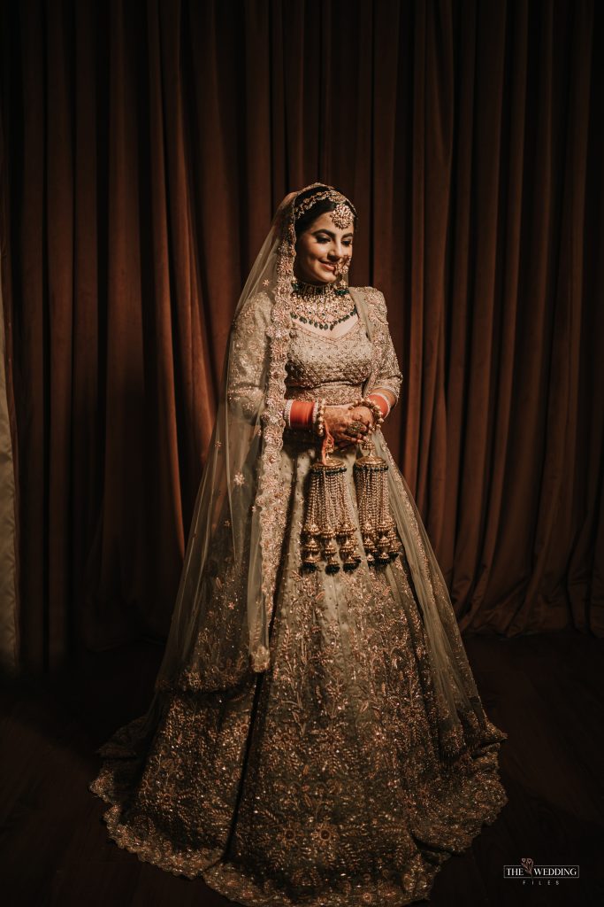 Indian bride in olive green bridal lehenga 