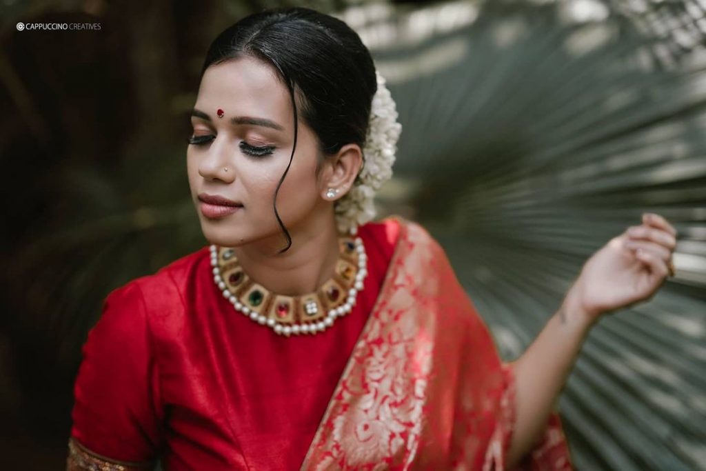 bride in traditional red saree for wedding